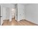 A crisp, bright bedroom with hard wood floors and a full bathroom at 4414 Aldenham Way, Suwanee, GA 30024