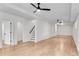 Spacious basement area with sleek hardwood floors and neutral white walls at 4414 Aldenham Way, Suwanee, GA 30024