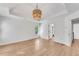 Spacious bedroom featuring a modern light fixture and an ensuite bathroom at 4414 Aldenham Way, Suwanee, GA 30024