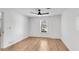 Bedroom featuring hardwood floors, a ceiling fan, and neutral colors at 4414 Aldenham Way, Suwanee, GA 30024