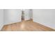 Bedroom entrance featuring hardwood floors and a bathroom with a sink at 4414 Aldenham Way, Suwanee, GA 30024