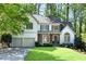 Charming two-story home with a well-manicured lawn and an attached two-car garage at 4414 Aldenham Way, Suwanee, GA 30024