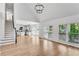 Spacious living room with vaulted ceilings, wood floors, fireplace, and an open floor plan at 4414 Aldenham Way, Suwanee, GA 30024