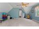 Upper level bonus room featuring neutral carpet, bright natural lighting and a vaulted ceiling at 4531 Cedar Dr, Loganville, GA 30052