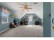 Spacious upper level bonus room with a vaulted ceiling and natural light at 4531 Cedar Dr, Loganville, GA 30052