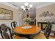 Dining area featuring a round table with decorative centerpiece and classic furnishings at 4531 Cedar Dr, Loganville, GA 30052