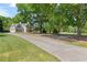 Two-story home with light-blue siding and a long driveway leading up to the garage and home at 4531 Cedar Dr, Loganville, GA 30052
