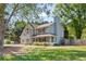 Charming two-story home featuring light blue siding, a cozy front porch, and a well-manicured lawn at 4531 Cedar Dr, Loganville, GA 30052