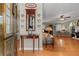 Warm and inviting foyer with hardwood floors, decorative console table, and access to the living room at 4531 Cedar Dr, Loganville, GA 30052