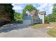 Attached two-car garage with light-blue siding and red shutters, perfect for storage and parking at 4531 Cedar Dr, Loganville, GA 30052