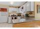 Functional kitchen featuring white cabinets, stainless steel appliances, and granite countertops at 4531 Cedar Dr, Loganville, GA 30052
