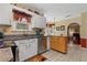 Open kitchen with white cabinets, stainless steel dishwasher, and tile flooring at 4531 Cedar Dr, Loganville, GA 30052