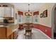 Eat-in kitchen area with bar height island and bright natural lighting at 4531 Cedar Dr, Loganville, GA 30052
