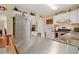 Kitchen with stainless steel appliances, white cabinets, and an island with breakfast bar at 4531 Cedar Dr, Loganville, GA 30052