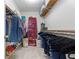 Spacious walk-in closet offering ample storage with shelving and hanging rods for organized clothing and accessories at 4531 Cedar Dr, Loganville, GA 30052