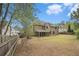 Expansive backyard featuring a screened porch and a well-maintained lawn at 5222 Camden Lake Nw Pkwy, Acworth, GA 30101