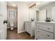 Stylish bathroom featuring a dual vanity with modern fixtures and a separate water closet at 5222 Camden Lake Nw Pkwy, Acworth, GA 30101