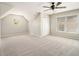 Spacious bedroom with a unique circular window and plush carpeting at 5222 Camden Lake Nw Pkwy, Acworth, GA 30101
