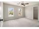 Bright bedroom with large windows, neutral walls, and access to a walk-in closet at 5222 Camden Lake Nw Pkwy, Acworth, GA 30101