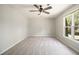 Bright bedroom with a large window overlooking the backyard and ceiling fan at 5222 Camden Lake Nw Pkwy, Acworth, GA 30101