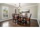 Elegant dining room featuring hardwood floors, crown molding, and natural lighting at 5222 Camden Lake Nw Pkwy, Acworth, GA 30101