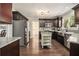 Stylish kitchen with stainless steel appliances, granite countertops and a light-green kitchen island at 5222 Camden Lake Nw Pkwy, Acworth, GA 30101