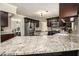 Spacious kitchen with granite countertops, stainless steel appliances, and dark wood cabinets at 5222 Camden Lake Nw Pkwy, Acworth, GA 30101