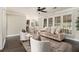 Relaxing living room with plantation shutters, hardwood floors, and a neutral color palette at 5222 Camden Lake Nw Pkwy, Acworth, GA 30101