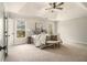 Serene main bedroom boasting plush carpeting, tray ceiling, and ample natural light at 5222 Camden Lake Nw Pkwy, Acworth, GA 30101