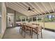 Covered patio with a dining table and chairs, perfect for outdoor entertaining at 5222 Camden Lake Nw Pkwy, Acworth, GA 30101