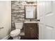 Charming powder room featuring decorative wall paneling and updated vanity at 5222 Camden Lake Nw Pkwy, Acworth, GA 30101