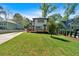 Expansive backyard with lush lawn, mature trees, and a view of the back of the home at 917 Derrydown Way, Decatur, GA 30030