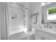 Modern bathroom features white subway tile in shower/bath and a bright vanity at 917 Derrydown Way, Decatur, GA 30030