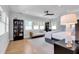 A spacious bedroom with a cozy sitting area, complemented by a glass-front bookcase, and lots of natural light at 917 Derrydown Way, Decatur, GA 30030