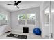 A bright bonus room with an exercise mat, exercise ball, and windows at 917 Derrydown Way, Decatur, GA 30030