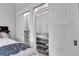 This is a bedroom closet with adjustable shelves and sliding doors at 917 Derrydown Way, Decatur, GA 30030