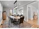 Elegant dining room with hardwood floors, modern lighting, and comfortable seating for eight at 917 Derrydown Way, Decatur, GA 30030