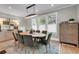 Spacious dining area featuring hardwood floors, modern lighting, and seating for six at 917 Derrydown Way, Decatur, GA 30030