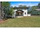 Two-story home with a welcoming front porch and a neatly landscaped lawn at 917 Derrydown Way, Decatur, GA 30030