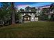 Charming new home featuring a inviting front porch, black roof, and lush front lawn at 917 Derrydown Way, Decatur, GA 30030