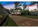 View of the home from the driveway highlighting the deck and manicured lawn at 917 Derrydown Way, Decatur, GA 30030