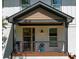 Close-up of a charming front porch with gray railings and a cozy, inviting atmosphere at 917 Derrydown Way, Decatur, GA 30030