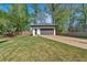 Detached two car garage featuring modern design, white exterior and grey door at 917 Derrydown Way, Decatur, GA 30030