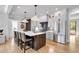 Modern kitchen featuring an island, stainless steel appliances, and ample cabinet space at 917 Derrydown Way, Decatur, GA 30030