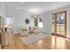 Sunlit living room featuring hardwood floors, two chairs, and stylish decor at 917 Derrydown Way, Decatur, GA 30030