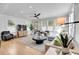 Bright living room featuring hardwood floors, large windows with natural light, and stylish furnishings at 917 Derrydown Way, Decatur, GA 30030