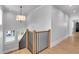 Bright staircase with hardwood floors and black iron railings lead to the next level at 917 Derrydown Way, Decatur, GA 30030