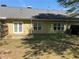 The home's backyard with a fenced yard and a concrete patio at 2575 Rosehill Circle, Lithia Springs, GA 30122