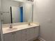 Bathroom featuring a double vanity and a large mirror at 2575 Rosehill Circle, Lithia Springs, GA 30122