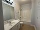 Well-lit bathroom with a single sink vanity and a shower-tub combo at 2575 Rosehill Circle, Lithia Springs, GA 30122